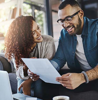 Couple review a financial statement together.